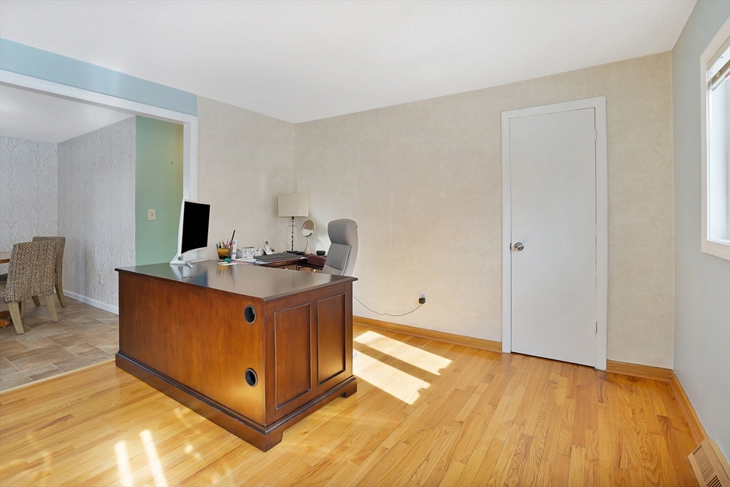 72 Gail Street Springfield, MA 01108 - Photo 13 of 35 a room with a bed and a mirror