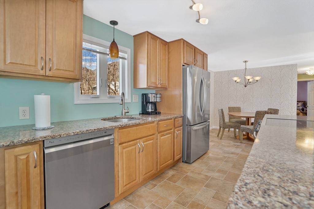 72 Gail Street Springfield, MA 01108 - Photo 15 of 35 a kitchen with stainless steel appliances granite countertop a refrigerator and a sink