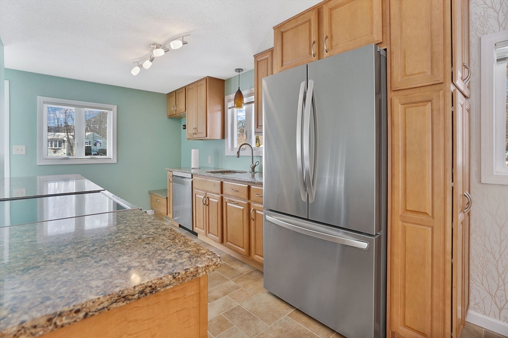 72 Gail Street Springfield, MA 01108 - Photo 16 of 35 a kitchen with stainless steel appliances granite countertop a refrigerator and a sink