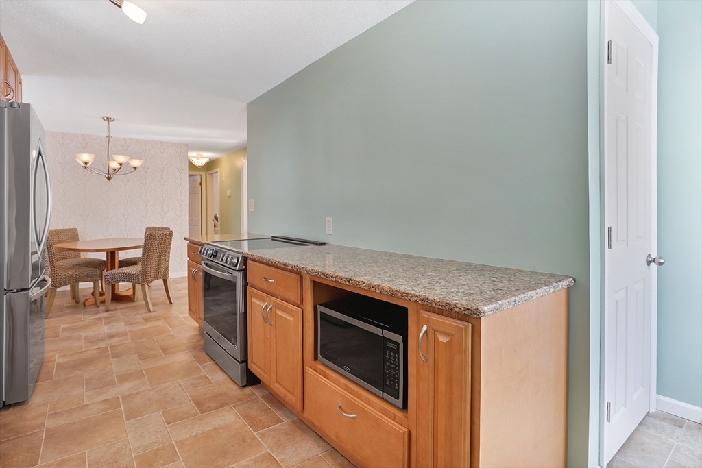 72 Gail Street Springfield, MA 01108 - Photo 17 of 35 a kitchen with a stove and a refrigerator