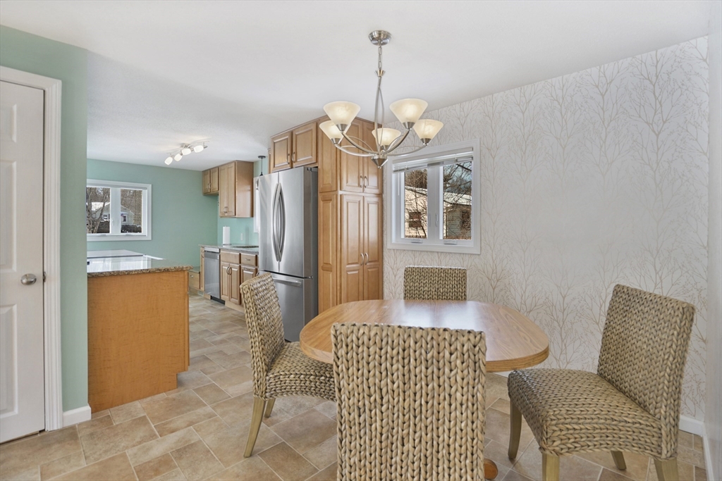 72 Gail Street Springfield, MA 01108 - Photo 20 of 35 a living room with furniture a chandelier and a dining table