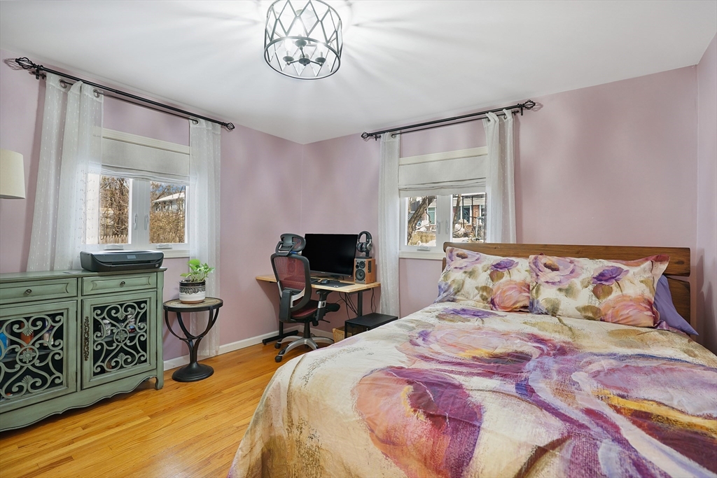 72 Gail Street Springfield, MA 01108 - Photo 26 of 35 a bedroom with a bed dresser and a flat tv screen