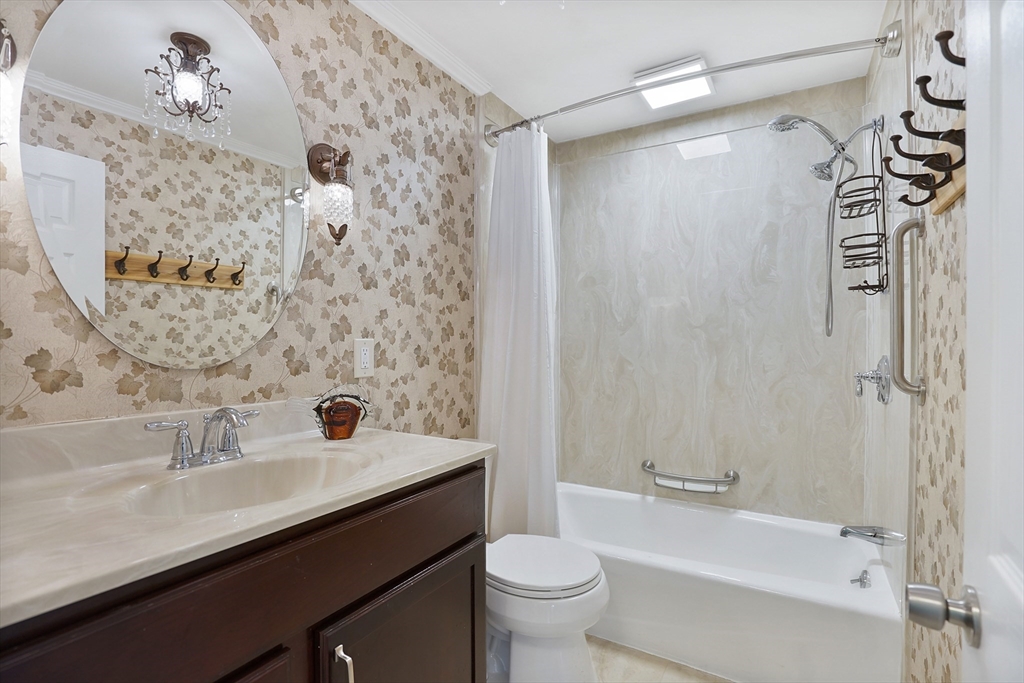 72 Gail Street Springfield, MA 01108 - Photo 29 of 35 a bathroom with a sink a toilet and shower
