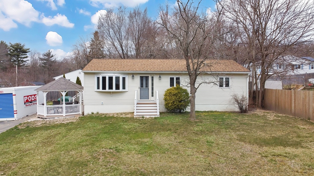 72 Gail Street Springfield, MA 01108 - Photo 3 of 35 a house that has a tree in front of it