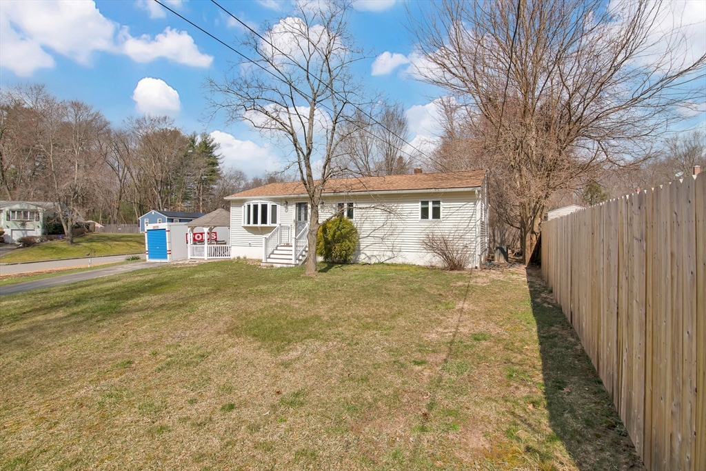 72 Gail Street Springfield, MA 01108 - Photo 5 of 35 a front view of a house with a yard and garage