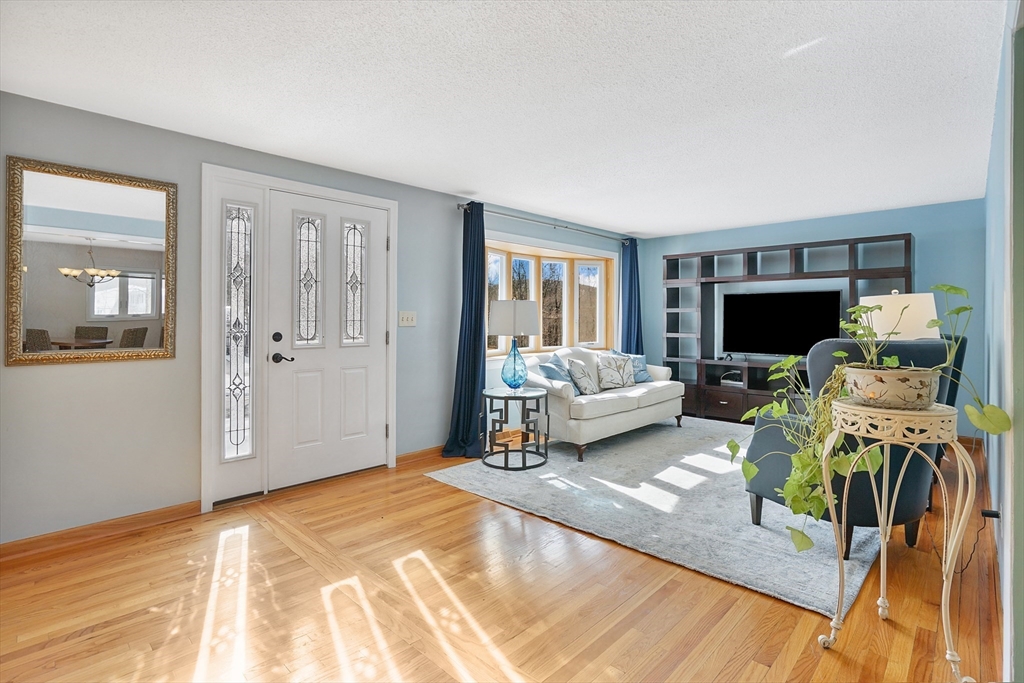 72 Gail Street Springfield, MA 01108 - Photo 7 of 35 a bedroom with furniture and a flat screen tv