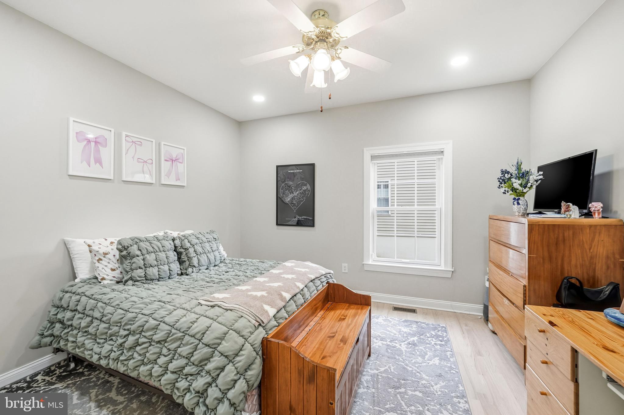 204 Bobwhite Road New Hope, PA 18938 - Photo 13 of 22 a bedroom with a large bed and a flat screen tv