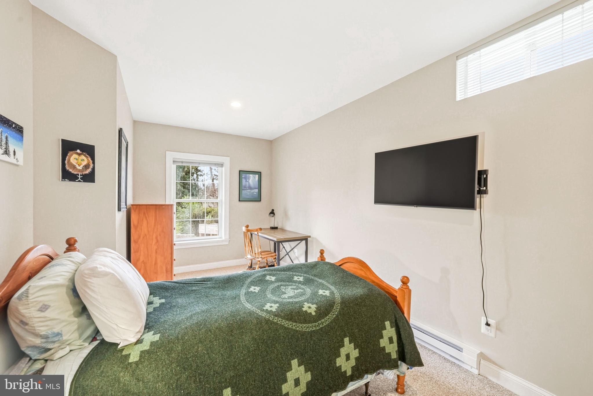 204 Bobwhite Road New Hope, PA 18938 - Photo 17 of 22 a living room with furniture and a flat screen tv