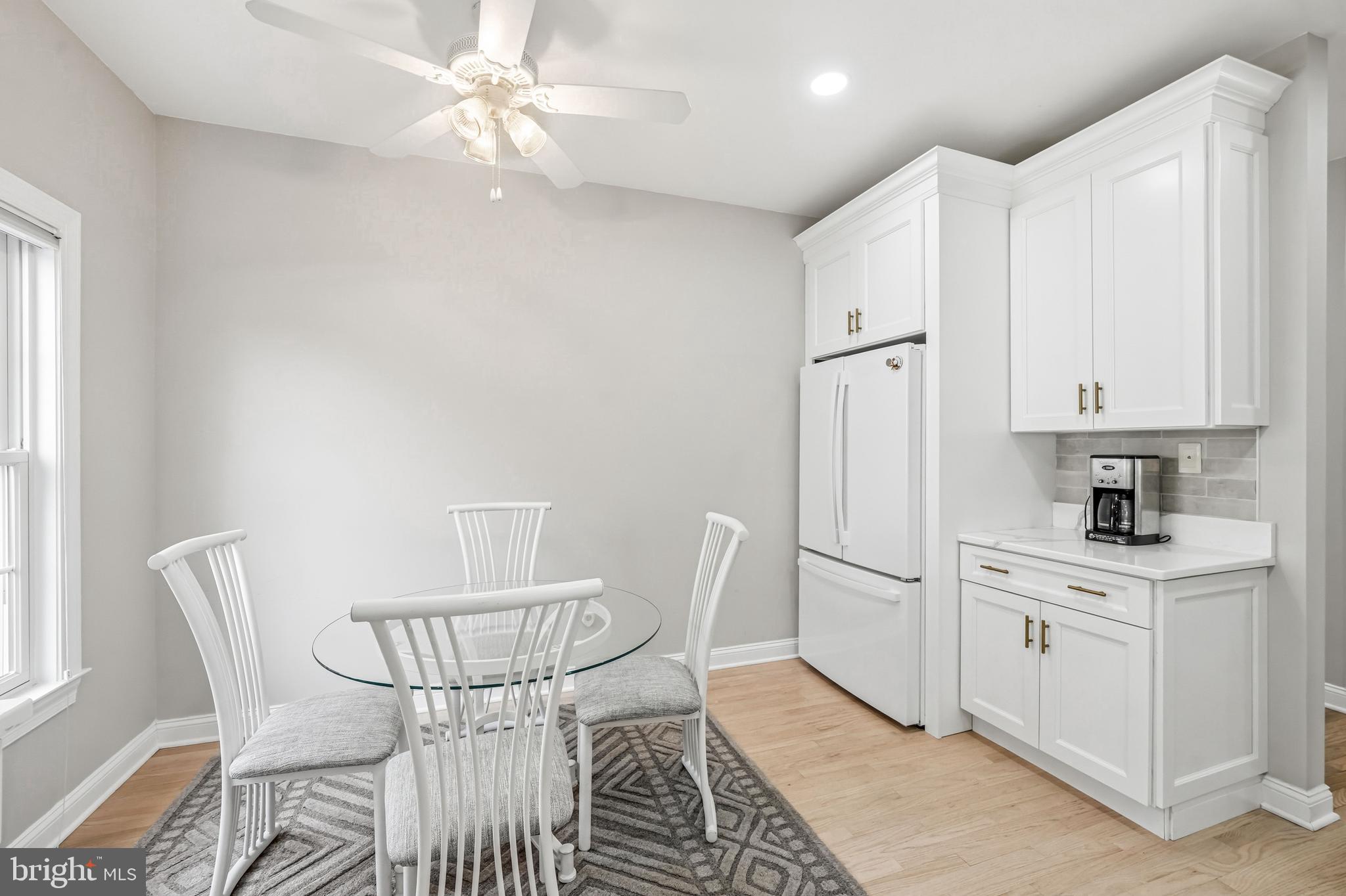 204 Bobwhite Road New Hope, PA 18938 - Photo 4 of 22 a kitchen with stainless steel appliances white cabinets and wooden floor