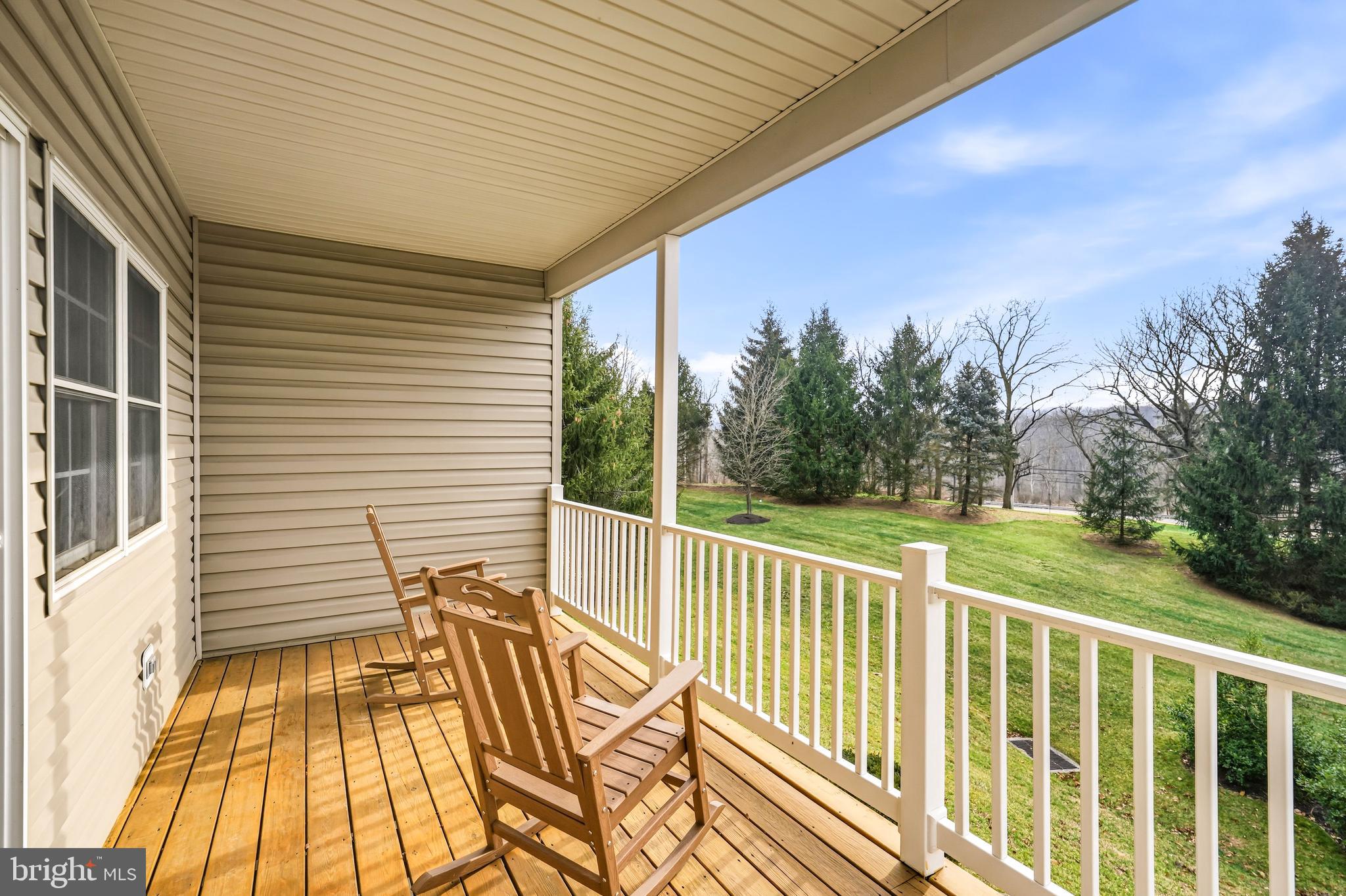 204 Bobwhite Road New Hope, PA 18938 - Photo 10 of 22 a view of a balcony with wooden floor and fence