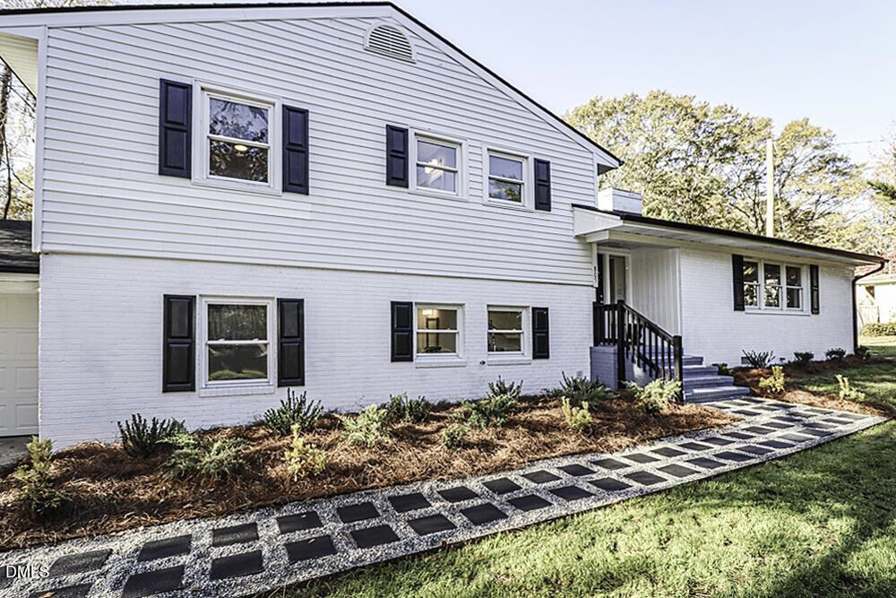 805 River Road Selma, NC 27576 - Photo 13 of 40 a front view of a house with garden