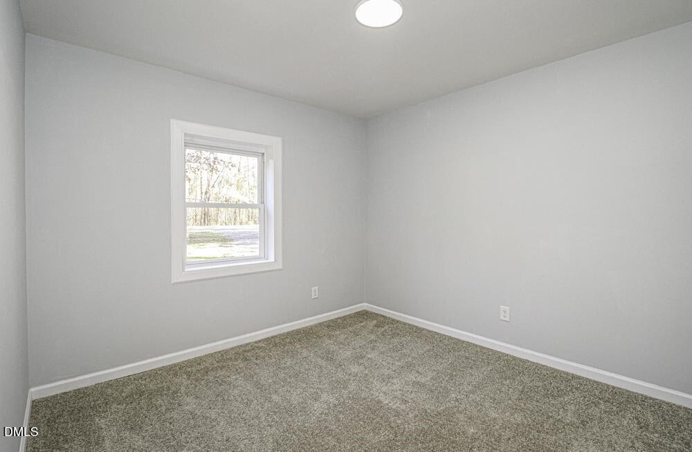 805 River Road Selma, NC 27576 - Photo 30 of 40 an empty room with a window
