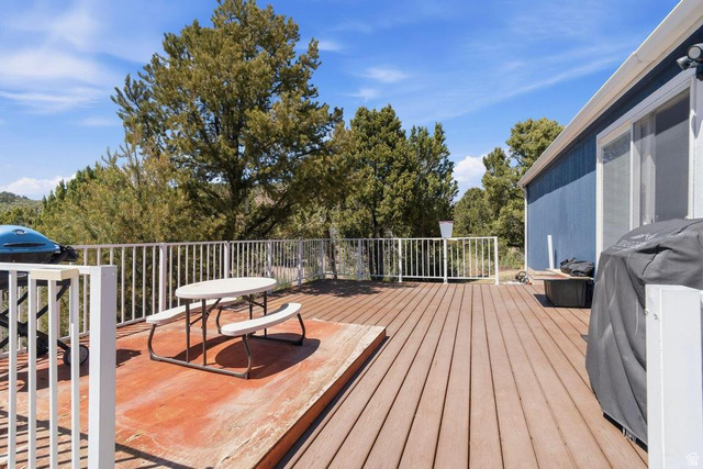327 North Lodge Road Central, UT 84722 - Photo 24 of 45 Expansive outdoor deck featuring wood-finish flooring, white railing, and a blue exterior siding