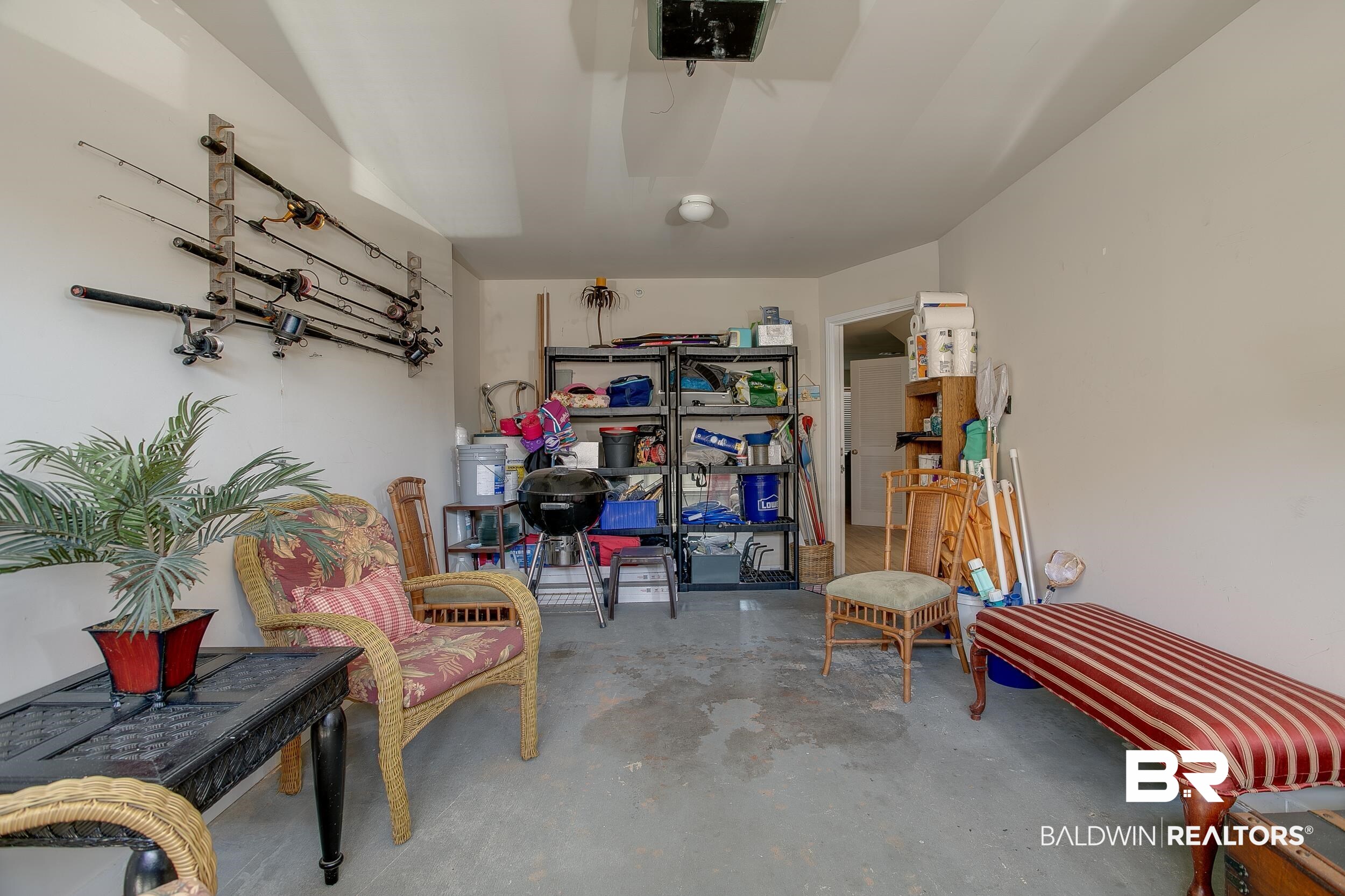 1517 Regency Road, Unit 33 Gulf Shores, AL 36542 - Photo 25 of 29 Garage with a garage door opener