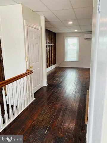 1717 Delaware Avenue, Unit 3 Wilmington, DE 19806 - Photo 3 of 6 an empty room with wooden floor and windows