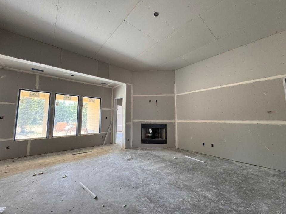 121 Oak Grv Way Springtown, TX 76082 - Photo 5 of 13 Recessed fireplace with a dark finish