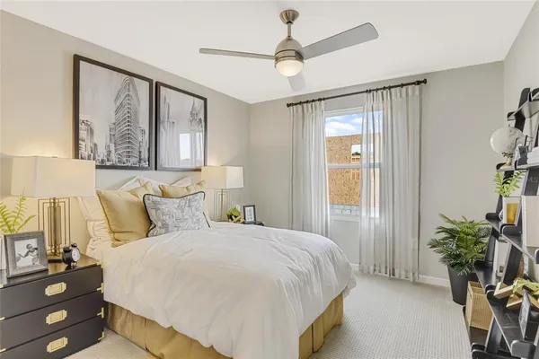 a bedroom with a large bed and a window