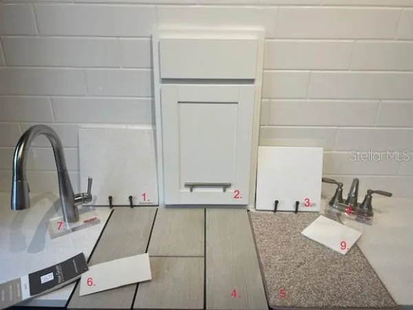 a room with a sink and a mirror