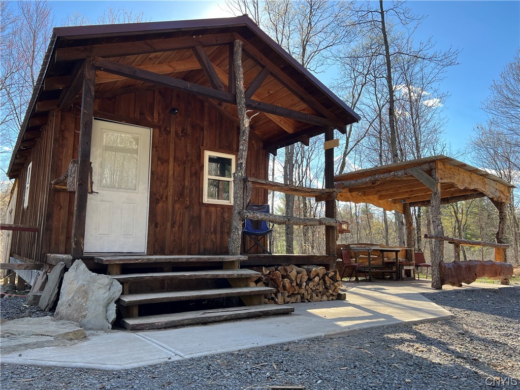 1727 County Rte 22 Altmar, NY 13302 - Photo 1 of 1 Beautiful front porch with natural wood accents