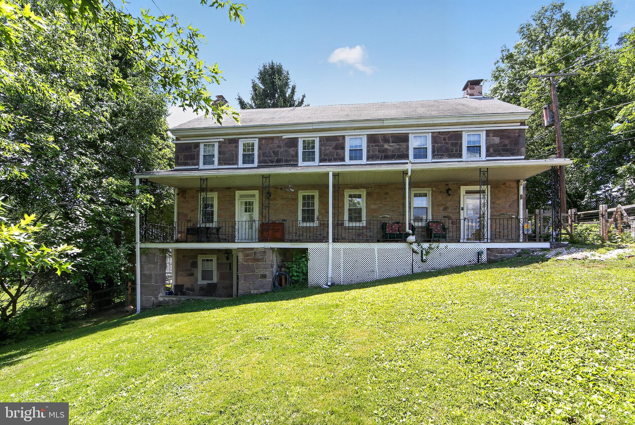 238 Brown Street Spring City, PA 19475 - Photo 3 of 57 Charming stone home with lush greenery.