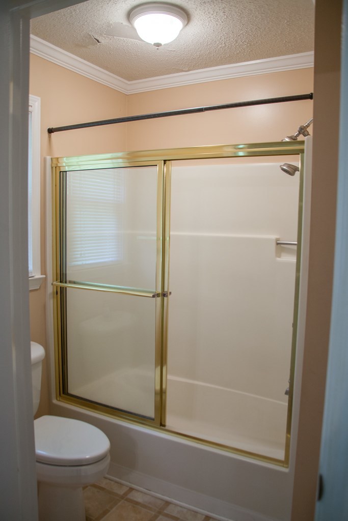 414 Homer Roberts Road Gray, GA 31032 - Photo 13 of 33 a bathroom with a toilet and a shower