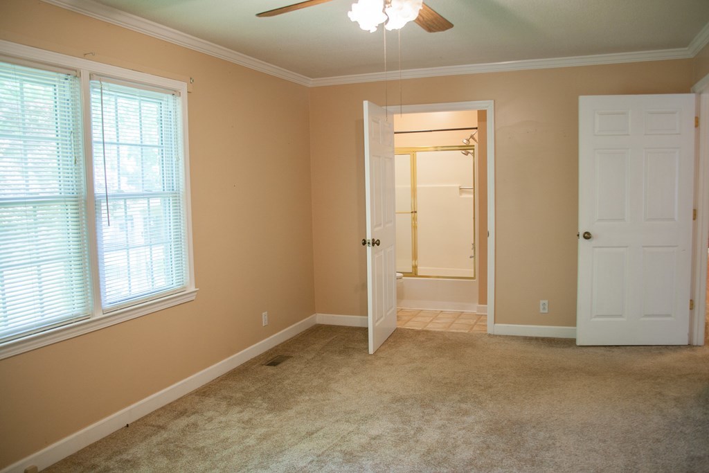 414 Homer Roberts Road Gray, GA 31032 - Photo 15 of 33 an empty room with windows and closet