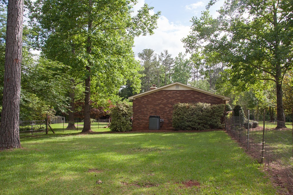 414 Homer Roberts Road Gray, GA 31032 - Photo 19 of 33 a view of a trees and barn in the middle of a yard