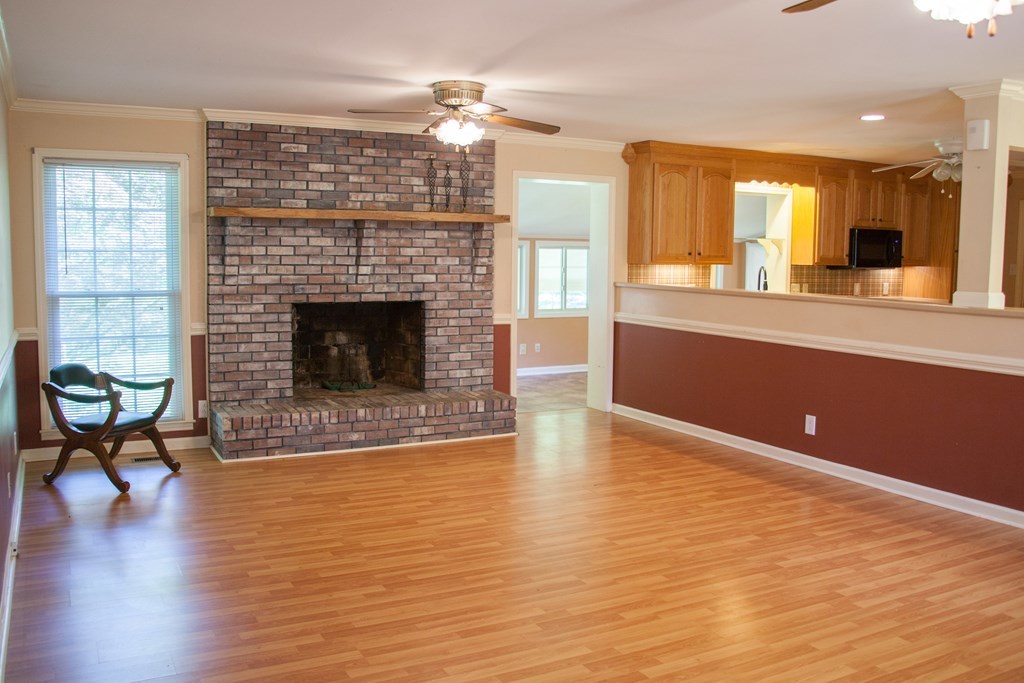 414 Homer Roberts Road Gray, GA 31032 - Photo 5 of 33 a living room with furniture and a fireplace