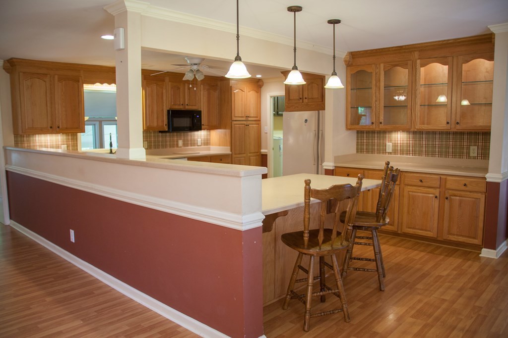 414 Homer Roberts Road Gray, GA 31032 - Photo 6 of 33 a large kitchen with a table and chairs