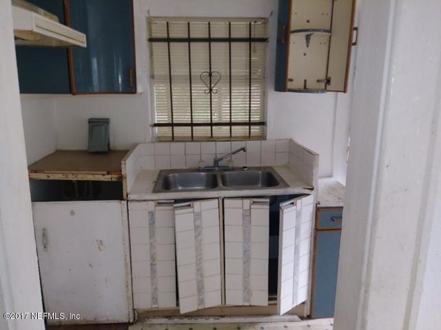 2022 Moncrief Road Jacksonville, FL 32209 - Photo 11 of 19 a kitchen with a sink and cabinets