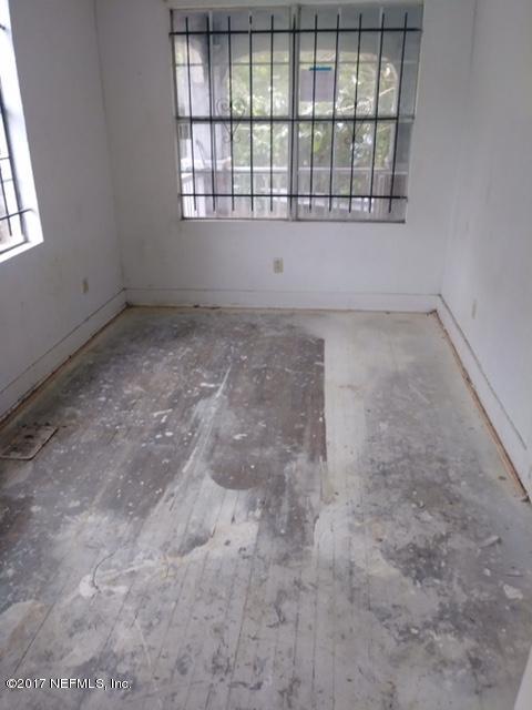 2022 Moncrief Road Jacksonville, FL 32209 - Photo 17 of 19 an empty room with a empty space and windows