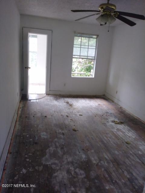2022 Moncrief Road Jacksonville, FL 32209 - Photo 4 of 19 an empty room that has a window in it