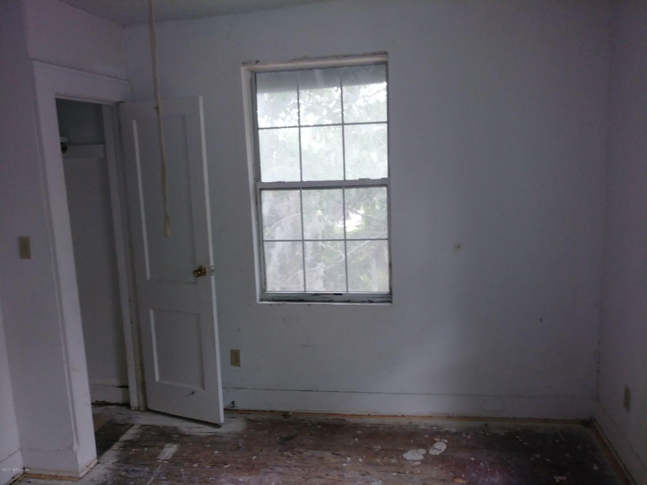 2022 Moncrief Road Jacksonville, FL 32209 - Photo 6 of 19 a view of an empty room with a window
