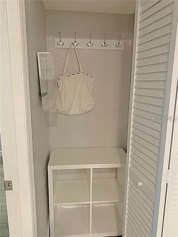 a view of a room with white walls