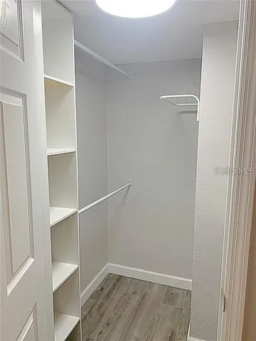 a view of an empty walk in closet