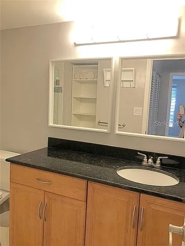 a bathroom with a sink and a mirror