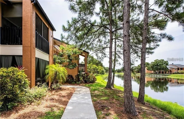 a backyard of a house with a lake view