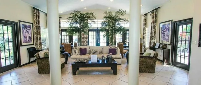 a lobby with furniture and floor to ceiling window