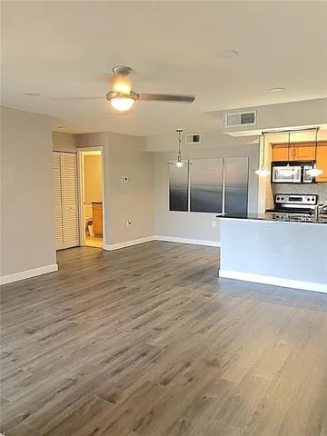 a view of a livingroom with wooden floor