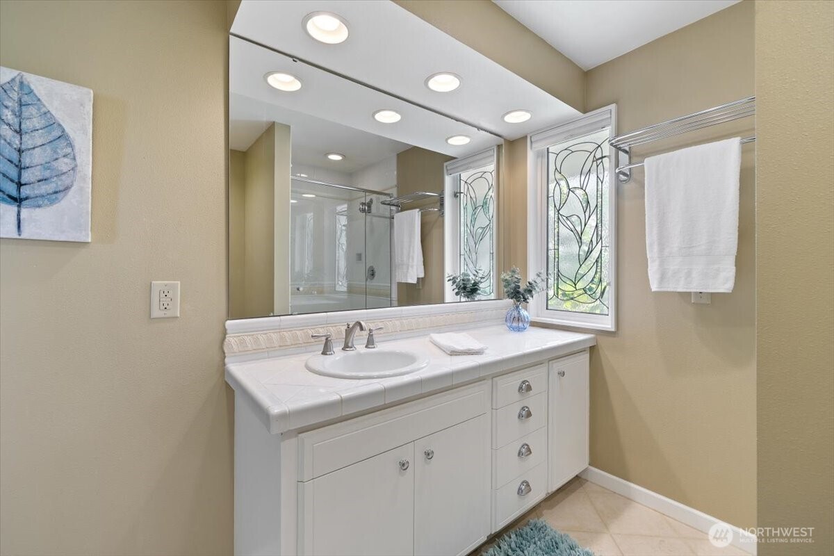 2606 49th Place Southwest Everett, WA 98203 - Photo 18 of 37 a spacious bathroom with a double vanity sink mirror and