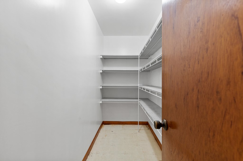 65 Caldwell Mountain Road Suches, GA 30572 - Photo 16 of 38 a view of walk in closet with empty racks