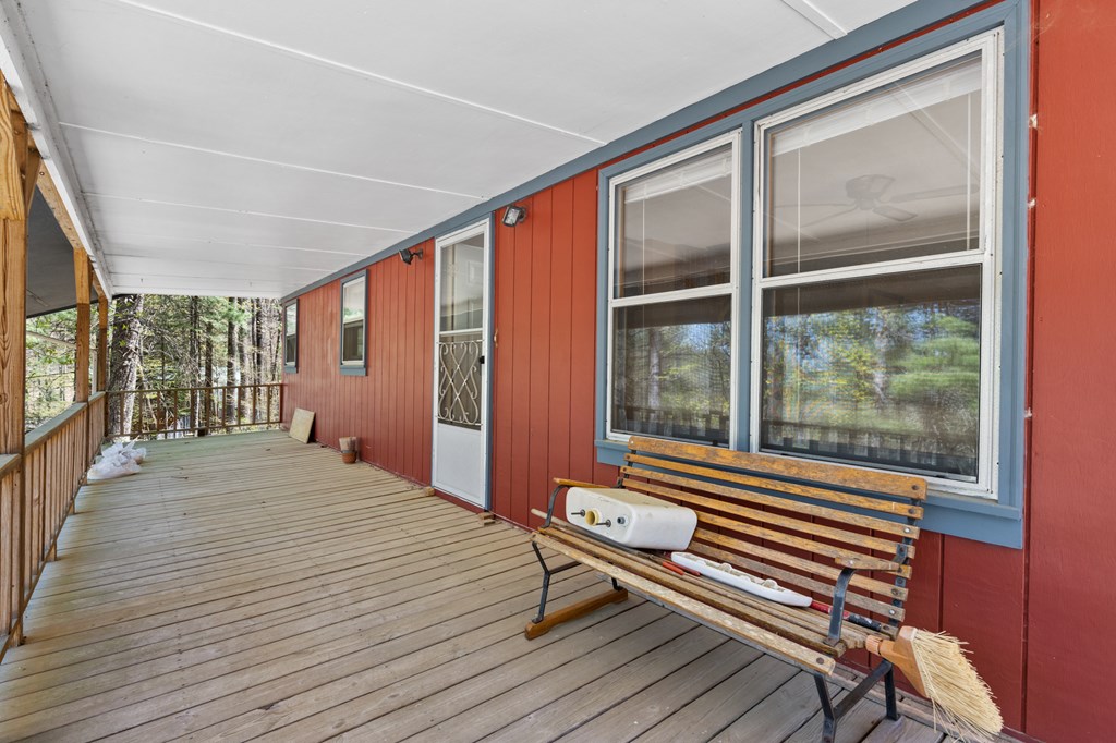 65 Caldwell Mountain Road Suches, GA 30572 - Photo 34 of 38 a bedroom with a bed and wooden floor
