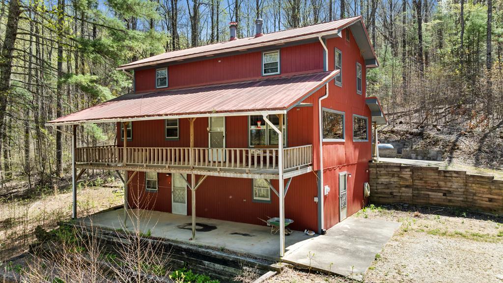 65 Caldwell Mountain Road Suches, GA 30572 - Photo 7 of 38 a view of a house with a wooden fence