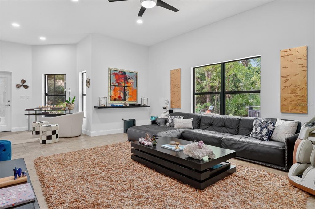 77 Apian Way Ormond Beach, FL 32174 - Photo 13 of 35 a living room with furniture and a large window
