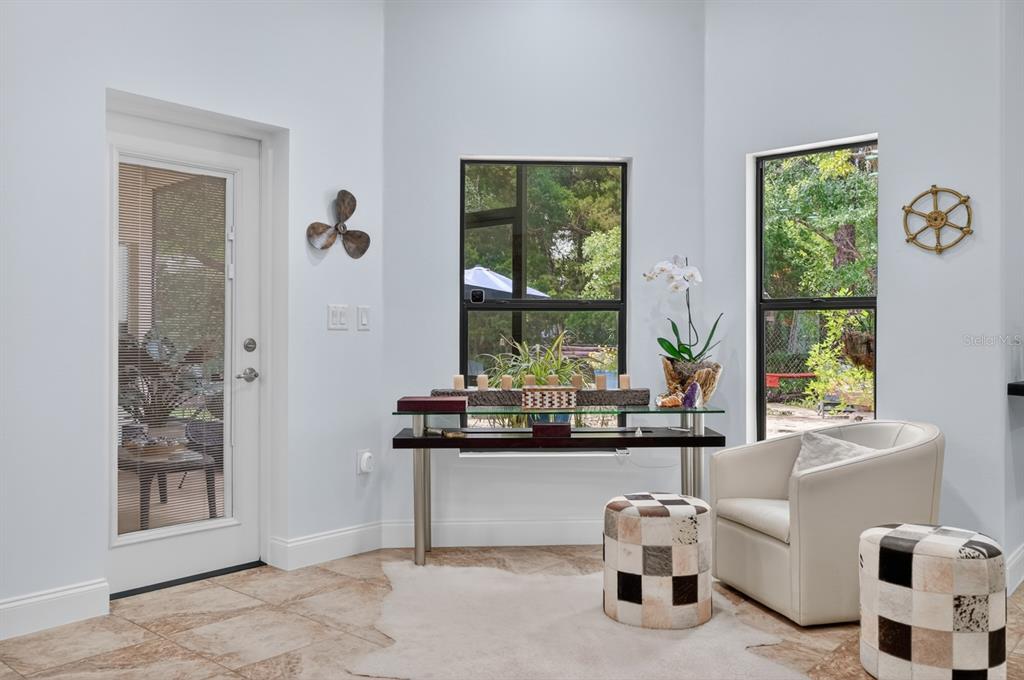 77 Apian Way Ormond Beach, FL 32174 - Photo 14 of 35 a living room with furniture and a window