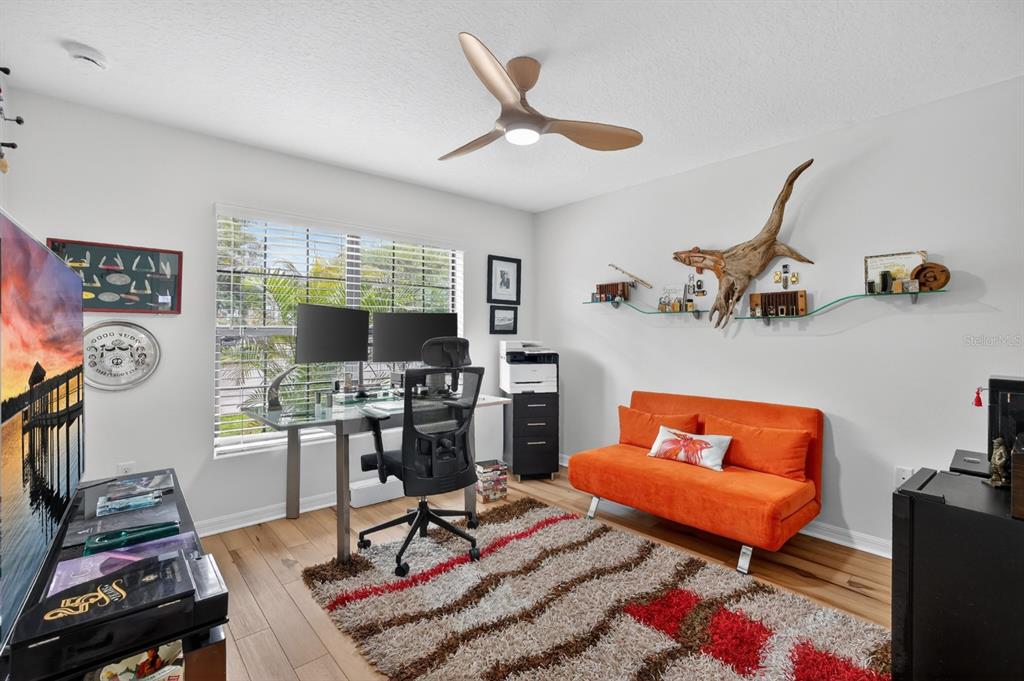 77 Apian Way Ormond Beach, FL 32174 - Photo 18 of 35 a living room with furniture a rug and a window