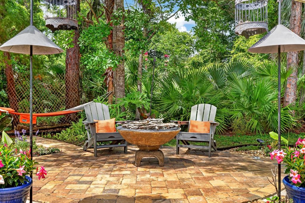 77 Apian Way Ormond Beach, FL 32174 - Photo 25 of 35 a garden view with a seating space