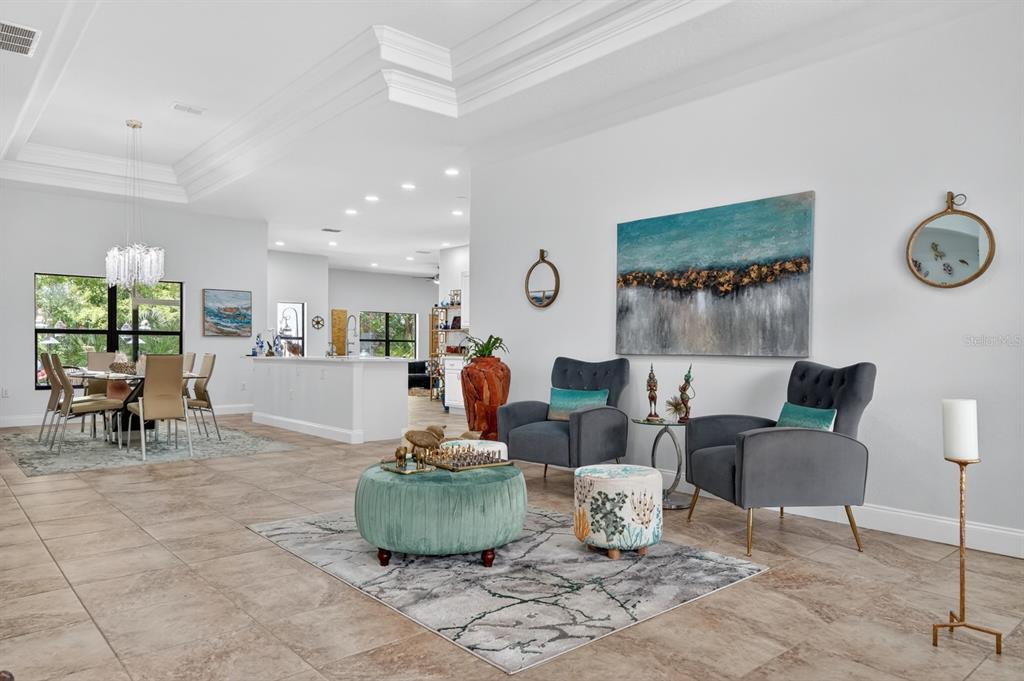 77 Apian Way Ormond Beach, FL 32174 - Photo 5 of 35 a living room with furniture and a table
