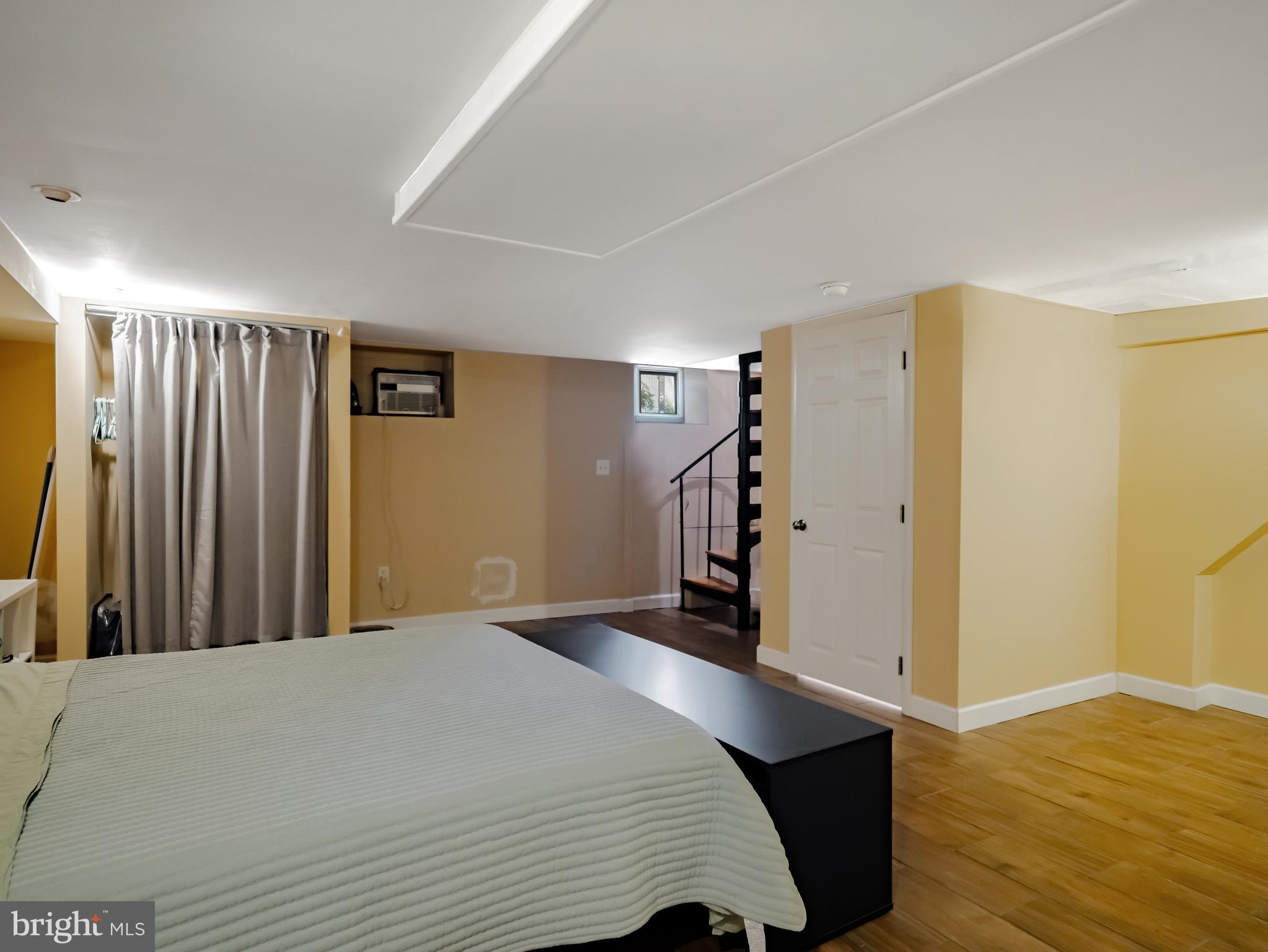 265 South 9th Street, Unit 1F Philadelphia, PA 19107 - Photo 12 of 15 a bedroom with a bed and a walk in closet