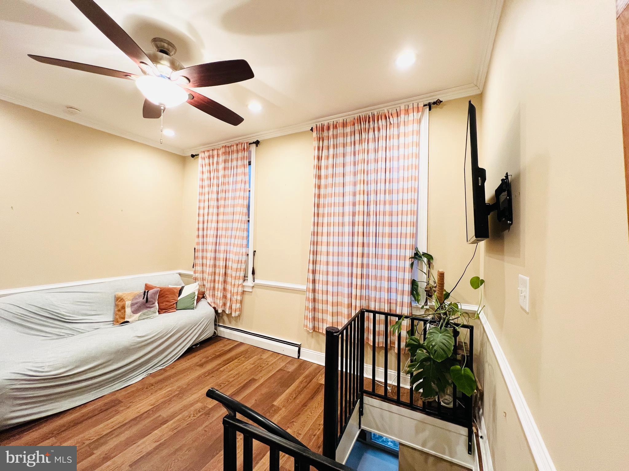 265 South 9th Street, Unit 1F Philadelphia, PA 19107 - Photo 6 of 15 a bedroom with furniture and a window